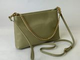 a green purse with a gold chain strap