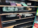 a shelf with many items on it in a store