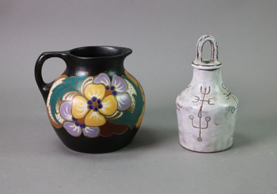 two vases sitting next to each other on a table