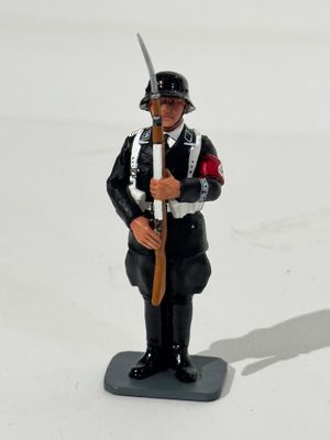 a figurine of a man in uniform holding a sword