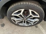 a close up of a tire on a car ' s rim