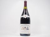 bottle of red wine on a white table with a white background