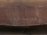 a close up of a wooden bowl on a table