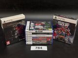 several video games are stacked on top of each other on a table