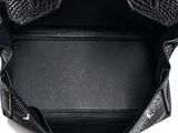 the inside of a black purse with a zipper on it