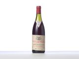 a bottle of wine that is sitting on a table