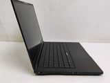 a black laptop computer sitting on a white surface