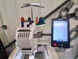 an image of a sewing machine with a computer on it