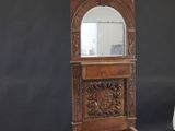 a wooden grandfather clock with an eagle on top of it