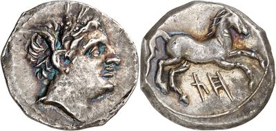 a silver coin with an image of a horse on it
