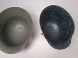 two helmets that are sitting on a table