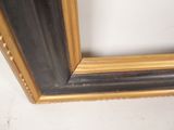 gold and black picture frame with rivets and rivets