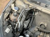 a car engine with the hood up and the hood down
