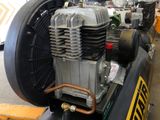 a small air compressor sitting on top of a table