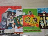 many different posters on the wall of a room