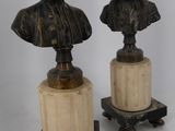 pair of bronze busts of a man and a woman on marble bases