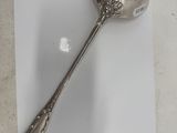 a spoon that is sitting on top of a piece of paper