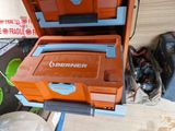 an orange and blue cooler sitting on top of a wooden table