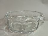 a glass bowl that is sitting on a table