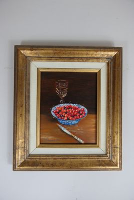 painting of a bowl of cherries on a table with a glass of wine in the background