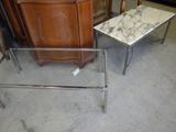 two tables that have marble tops on them in a room