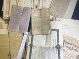 a pile of old papers that are on a table