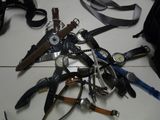 a lot of different types of watches on the table