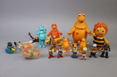 a lot of toy figurines that are on the table