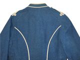 a close up of a blue jacket with white pips on it