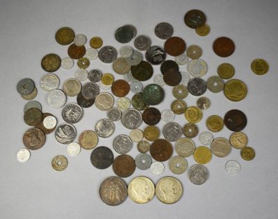 a pile of coins on a table with a white background