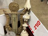 a box with a clock and other items in it