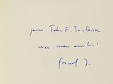 an old book with a handwritten poem on the front cover