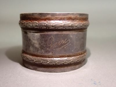 a close up of a silver box with a writing on it