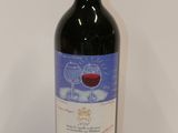 a bottle of wine that is sitting on a table