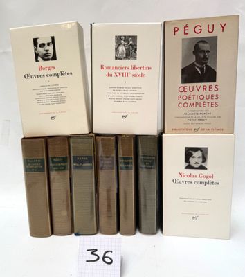several books are stacked on top of each other on a table