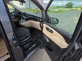 a car door open with the driver ' s side door open