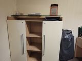 a cupboard with a glass top in a room