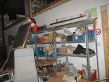 a room that has a bunch of items on the shelves
