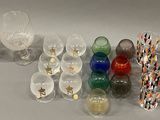 many different colored glass items on the table