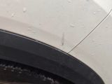 a close up of a car tire with water droplets on it