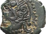 une pièce de monnaie ancienne sur laquelle figure l'image d'un oiseau