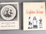 two books on a table with pictures of people on them