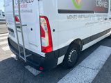 a white van that is parked on the side of the road
