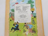 an old children ' s book with a picture of a man and a woman in a park
