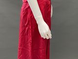a mannequin wearing a red skirt and a white shirt