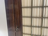 an image of a tall wooden cabinet with a glass door