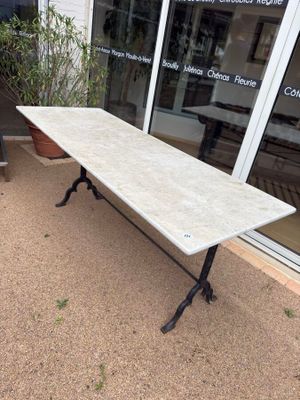 a long table with a marble top on a patio