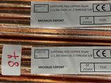 several different types of copper pipes are stacked on top of each other