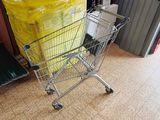 a shopping cart sitting in the middle of a room