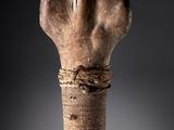 a close up of a wooden object with a rope wrapped around it